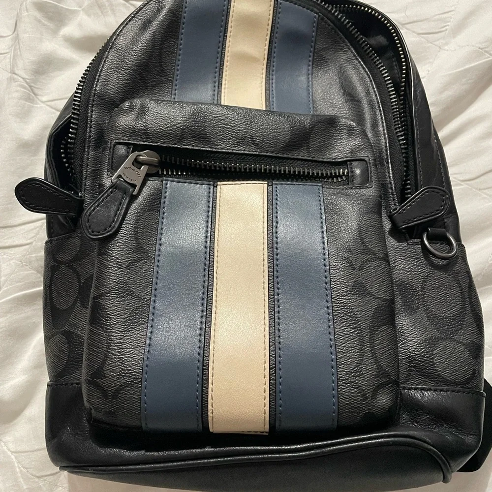 coach backpack with blue white stripe West Coach Signature coated canvas and smooth leather Inside multifunction pocket Zip closure Coach West Backpack In Signature